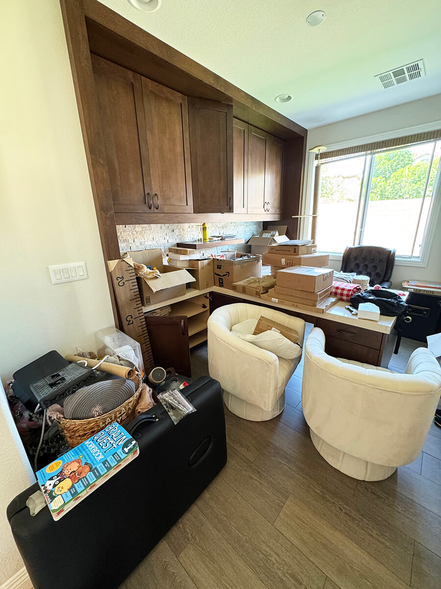 Cluttered executive office with stacked case files and unsorted documents before Lifelystyle confidential office organization in Las Vegas