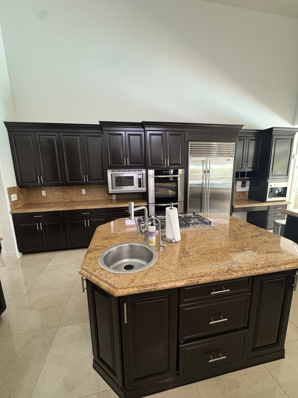 Las Vegas kitchen once packing is finished — granite island and counters cleared, cabinets closed and nothing left loose before moving day